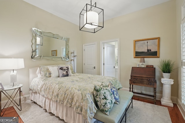 104 Glentown Way, Sandy Springs, GA 30328 - bedroom featuring baseboards, connected bathroom, and wood finished floors