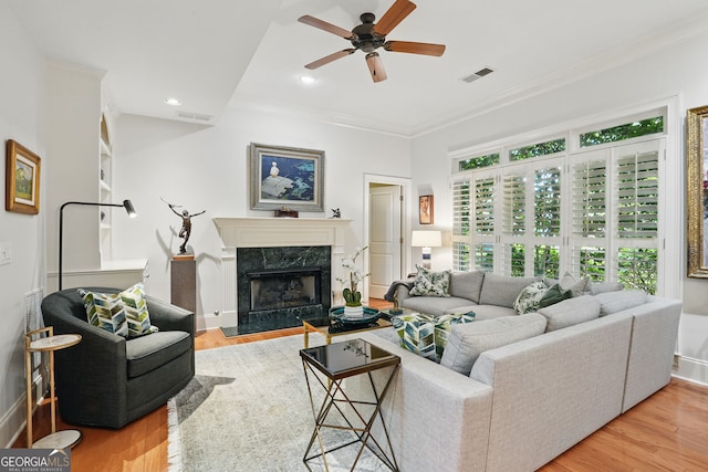 104 Glentown Way, Sandy Springs, GA 30328 - living room featuring visible vents, a ceiling fan, light wood-style floors, and ornamental molding