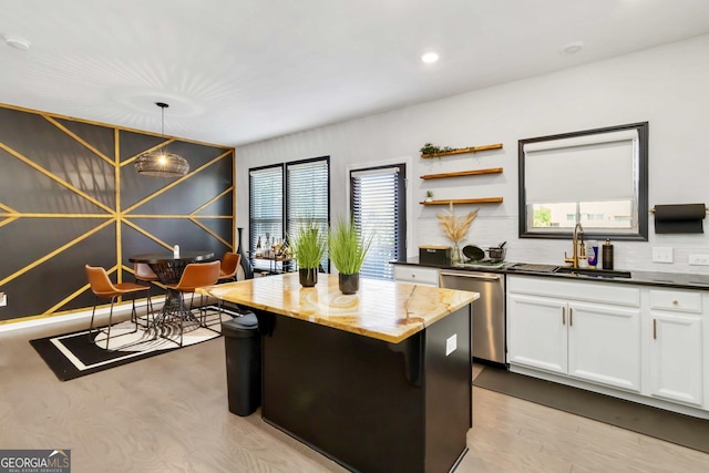 371 Northaven Ave, Suwanee, GA 30024 - kitchen featuring dishwasher, a sink, healthy amount of natural light, white cabinetry, and recessed lighting
