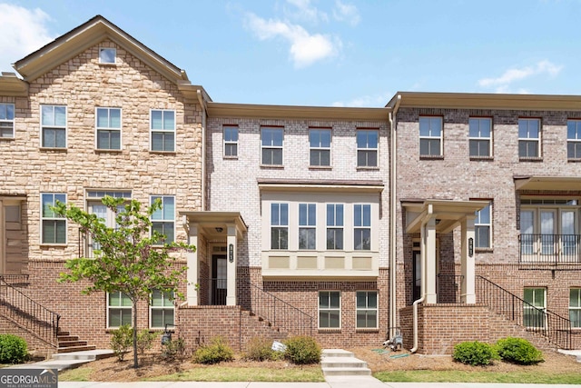 371 Northaven Ave, Suwanee, GA 30024 - view of property with stairs and brick siding