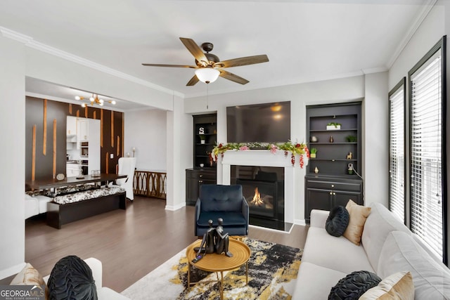 371 Northaven Ave, Suwanee, GA 30024 - living area featuring wood finished floors, ceiling fan, crown molding, and a glass covered fireplace