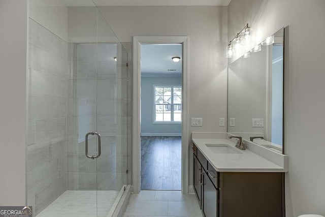 bathroom featuring a shower stall, vanity, and tile patterned flooring