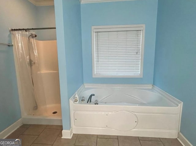 full bathroom with a bath, baseboards, tile patterned flooring, and a stall shower