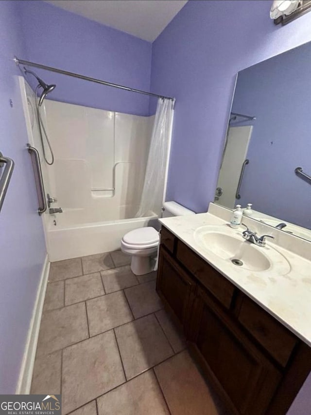 full bathroom featuring shower / bath combination with curtain, tile patterned flooring, vanity, and toilet
