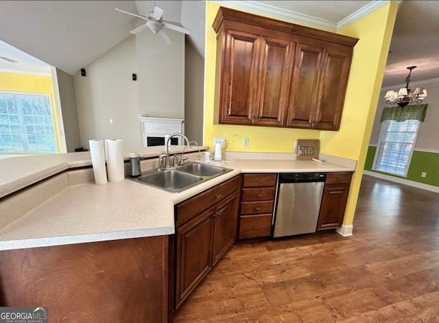 kitchen featuring stainless steel dishwasher, wood finished floors, a sink, ceiling fan with notable chandelier, and light countertops
