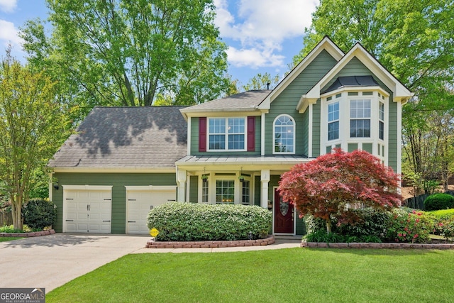 2267 Howell Farms Trl, Acworth, GA 30101 - view of front facade with a shingled roof, concrete driveway, a front lawn, and a garage