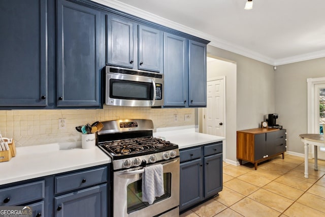 2267 Howell Farms Trl, Acworth, GA 30101 - kitchen featuring light countertops, blue cabinetry, appliances with stainless steel finishes, and tasteful backsplash