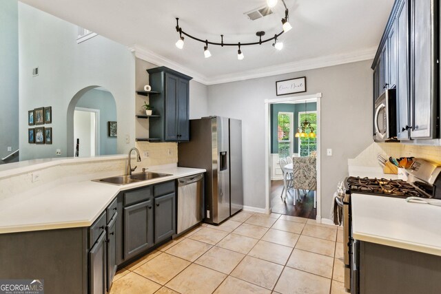 2267 Howell Farms Trl, Acworth, GA 30101 - kitchen with stainless steel appliances, open shelves, visible vents, a sink, and arched walkways