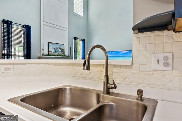 2267 Howell Farms Trl, Acworth, GA 30101 - room details with tasteful backsplash, a sink, and light countertops