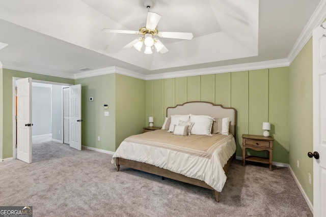 2267 Howell Farms Trl, Acworth, GA 30101 - bedroom featuring a tray ceiling, carpet, ceiling fan, and ornamental molding