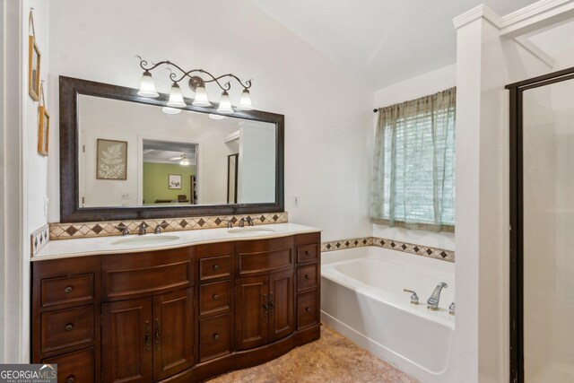 2267 Howell Farms Trl, Acworth, GA 30101 - bathroom with backsplash, a bath, and a sink