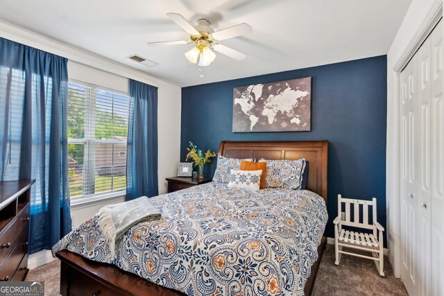 2267 Howell Farms Trl, Acworth, GA 30101 - carpeted bedroom with ceiling fan, visible vents, and a closet