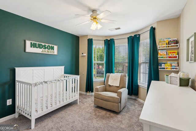 2267 Howell Farms Trl, Acworth, GA 30101 - bedroom with a crib, ceiling fan, baseboards, carpet flooring, and visible vents
