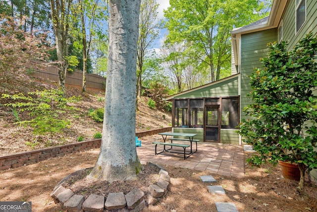 2267 Howell Farms Trl, Acworth, GA 30101 - view of patio featuring a sunroom and fence