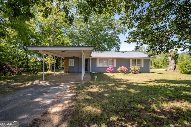 615 Sanford Rd, Hull, GA 30646 - view of front of home featuring a carport, a front lawn, aphalt driveway, and metal roof