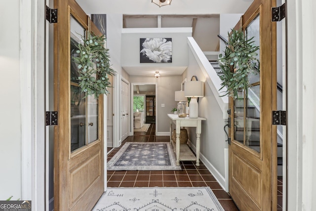 400 Peachtree Pkwy, Peachtree City, GA 30269 - foyer featuring dark tile patterned flooring, baseboards, and stairway