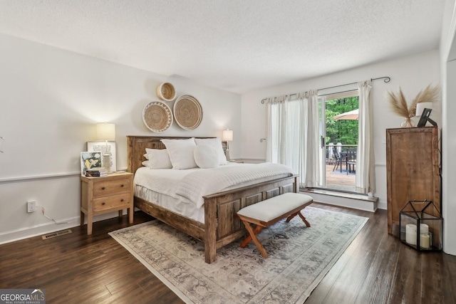 400 Peachtree Pkwy, Peachtree City, GA 30269 - bedroom featuring dark wood finished floors, a textured ceiling, and baseboards