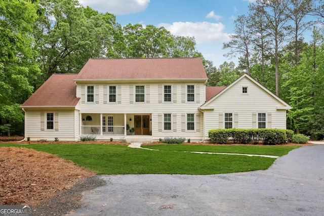 400 Peachtree Pkwy, Peachtree City, GA 30269 - colonial home featuring a porch and a front lawn