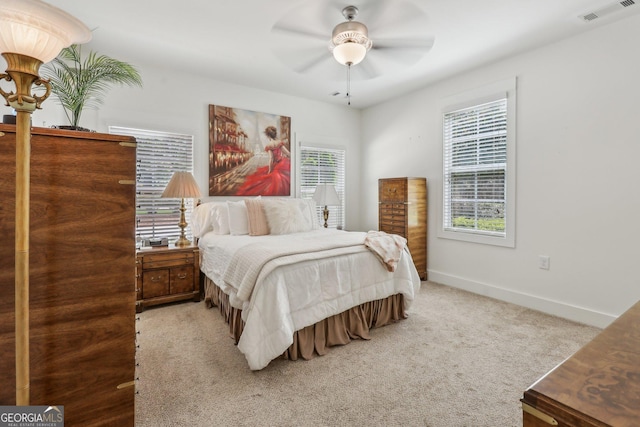 400 Peachtree Pkwy, Peachtree City, GA 30269 - carpeted bedroom with multiple windows, baseboards, and ceiling fan