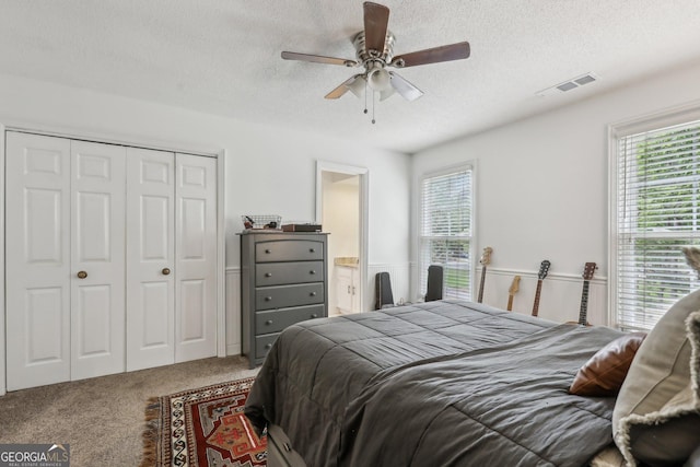 400 Peachtree Pkwy, Peachtree City, GA 30269 - bedroom with carpet floors, multiple windows, a textured ceiling, a closet, and ceiling fan