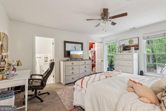 400 Peachtree Pkwy, Peachtree City, GA 30269 - carpeted bedroom featuring a ceiling fan, a spacious closet, a desk, and a closet