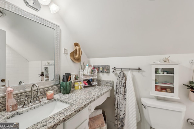 400 Peachtree Pkwy, Peachtree City, GA 30269 - bathroom with vaulted ceiling, toilet, and vanity