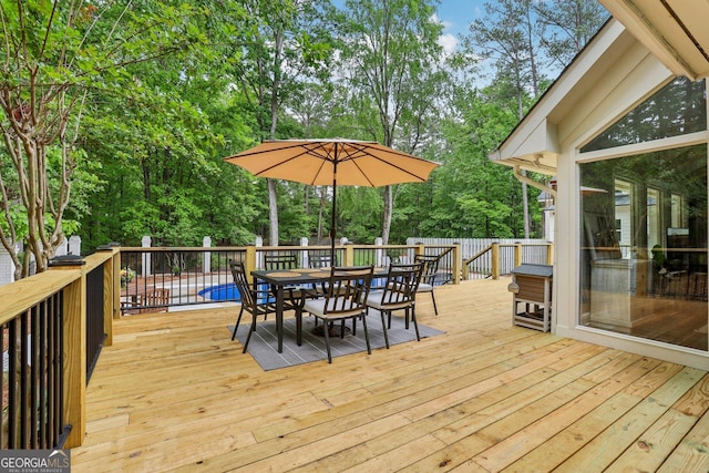 400 Peachtree Pkwy, Peachtree City, GA 30269 - deck featuring outdoor dining space and view of wooded area