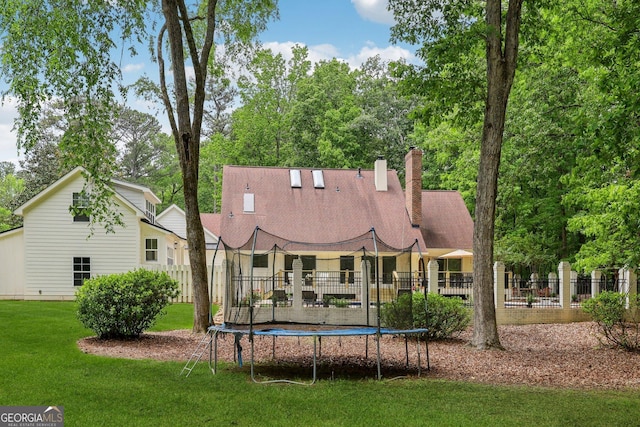 400 Peachtree Pkwy, Peachtree City, GA 30269 - rear view of property with a trampoline and a chimney