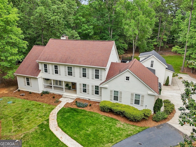 400 Peachtree Pkwy, Peachtree City, GA 30269 - view of front of home with a chimney, covered porch, and a front yard