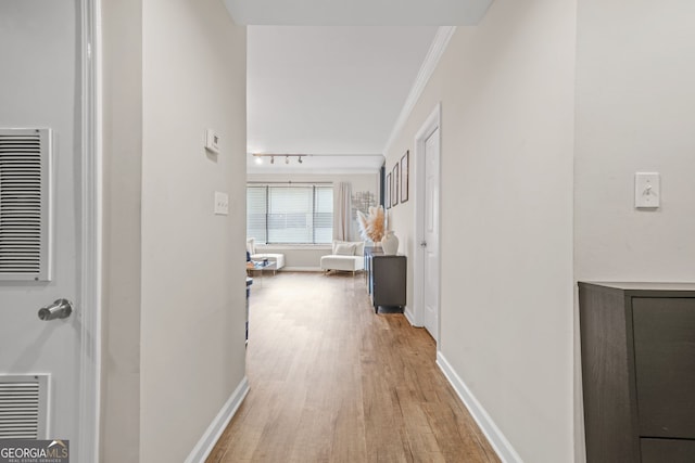 3481 Lakeside Dr NE Unit 601, Atlanta, GA 30326 - corridor featuring light wood-type flooring, baseboards, ornamental molding, and visible vents