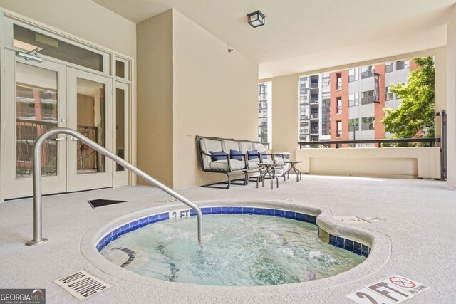 3481 Lakeside Dr NE Unit 601, Atlanta, GA 30326 - view of pool with french doors and an indoor hot tub