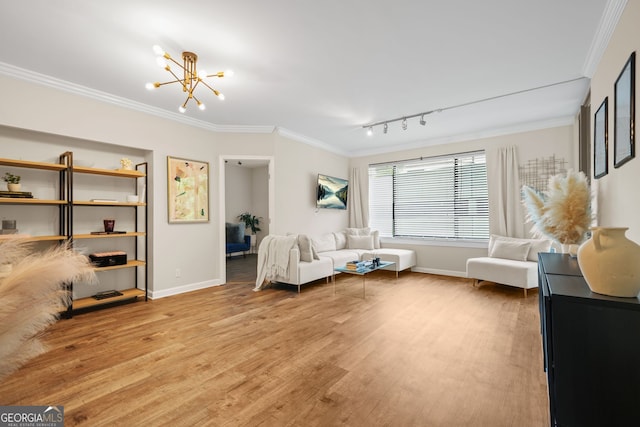 3481 Lakeside Dr NE Unit 601, Atlanta, GA 30326 - interior space featuring baseboards, a chandelier, light wood-style floors, crown molding, and track lighting