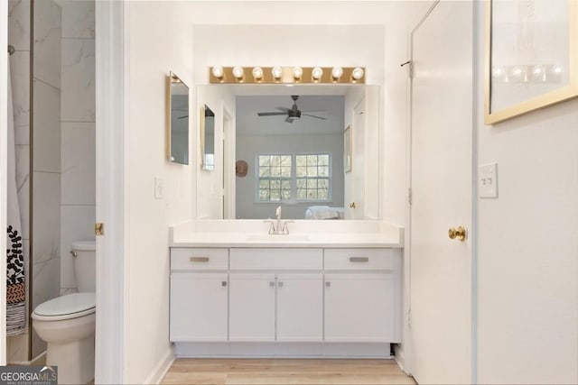 384 Teal Ct, Roswell, GA 30076 - ensuite bathroom featuring toilet, a ceiling fan, wood finished floors, vanity, and ensuite bath
