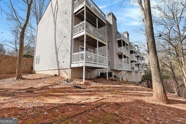 384 Teal Ct, Roswell, GA 30076 - back of property featuring a chimney and a balcony