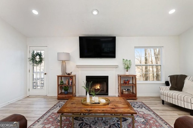384 Teal Ct, Roswell, GA 30076 - living area featuring baseboards, a warm lit fireplace, wood finished floors, and recessed lighting