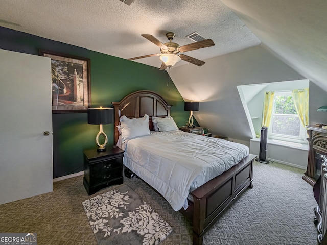 bedroom with a textured ceiling, baseboards, visible vents, carpet, and lofted ceiling