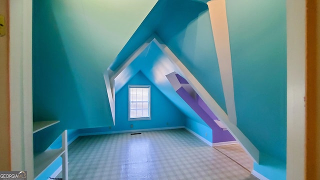 bonus room with baseboards, vaulted ceiling, visible vents, and carpet