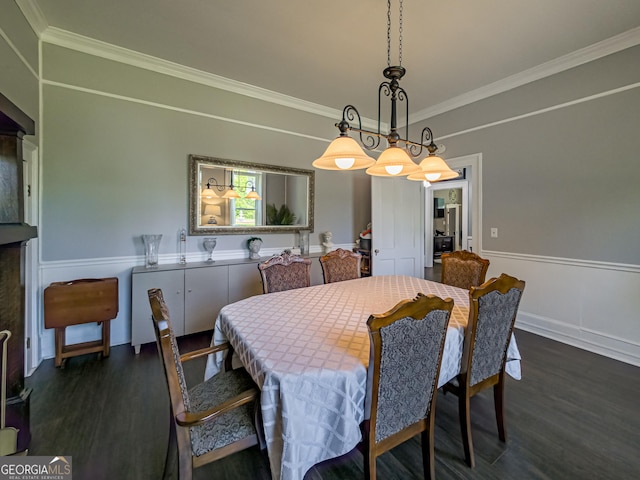 dining area featuring baseboards, crown molding, and dark wood-style floors