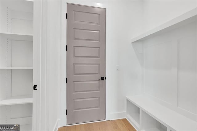 mudroom with light wood-type flooring and baseboards