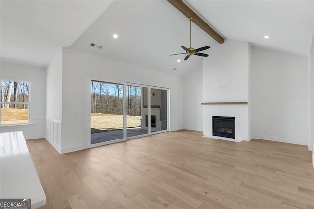 unfurnished living room with beamed ceiling, light wood-style floors, visible vents, and ceiling fan