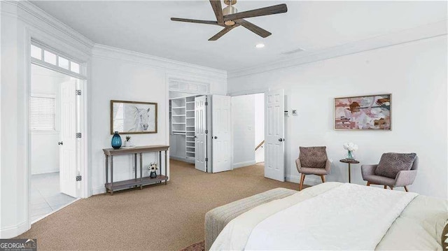 bedroom featuring crown molding, carpet, a spacious closet, baseboards, and recessed lighting