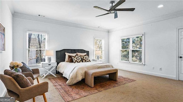 carpeted bedroom featuring crown molding, baseboards, ceiling fan, and recessed lighting