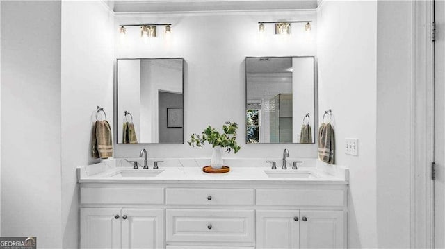 full bath featuring crown molding and double vanity