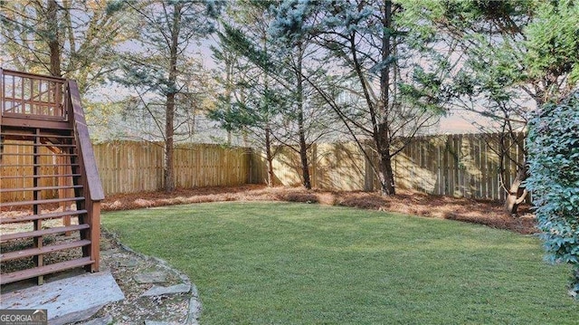 view of yard with stairway and a wooden deck