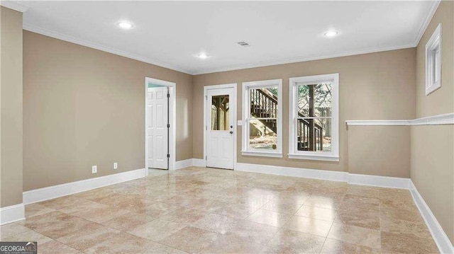 empty room featuring crown molding, baseboards, and recessed lighting