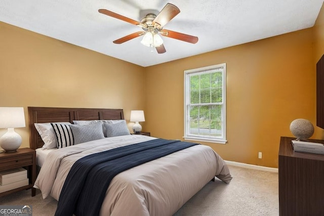 10044 Point View Dr, Jonesboro, GA 30238 - bedroom featuring light colored carpet, baseboards, and ceiling fan