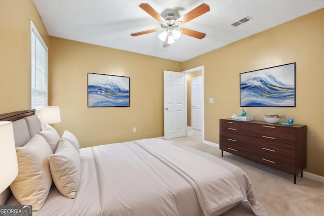 10044 Point View Dr, Jonesboro, GA 30238 - bedroom with visible vents, a ceiling fan, baseboards, and light carpet
