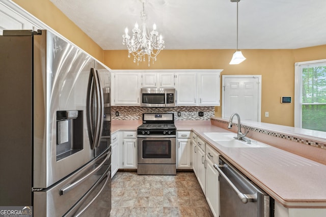 10044 Point View Dr, Jonesboro, GA 30238 - kitchen with a sink, light countertops, stainless steel appliances, white cabinetry, and tasteful backsplash