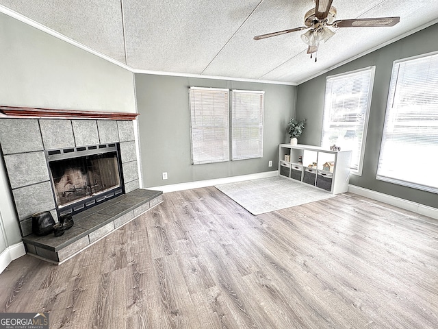 112 Little River Ct, Eatonton, GA 31024 - unfurnished living room with ornamental molding, a textured ceiling, and wood finished floors