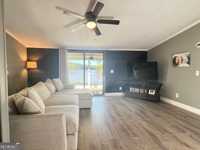 112 Little River Ct, Eatonton, GA 31024 - living area featuring wooden walls, ceiling fan, crown molding, and baseboards